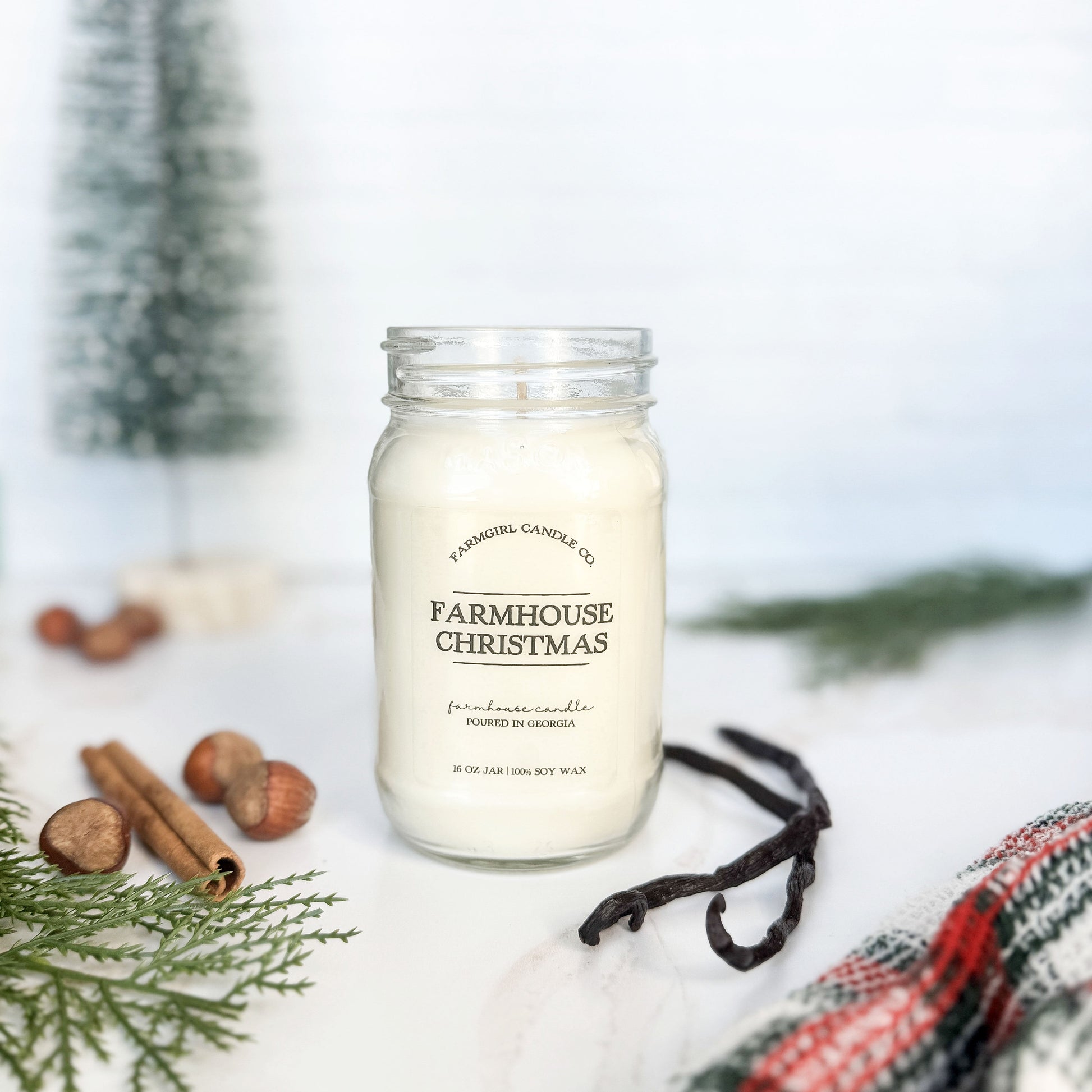 mason jar candle labeled 'Farmhouse Christmas' with pine, vanilla, spice, soy candle, farmhouse candle