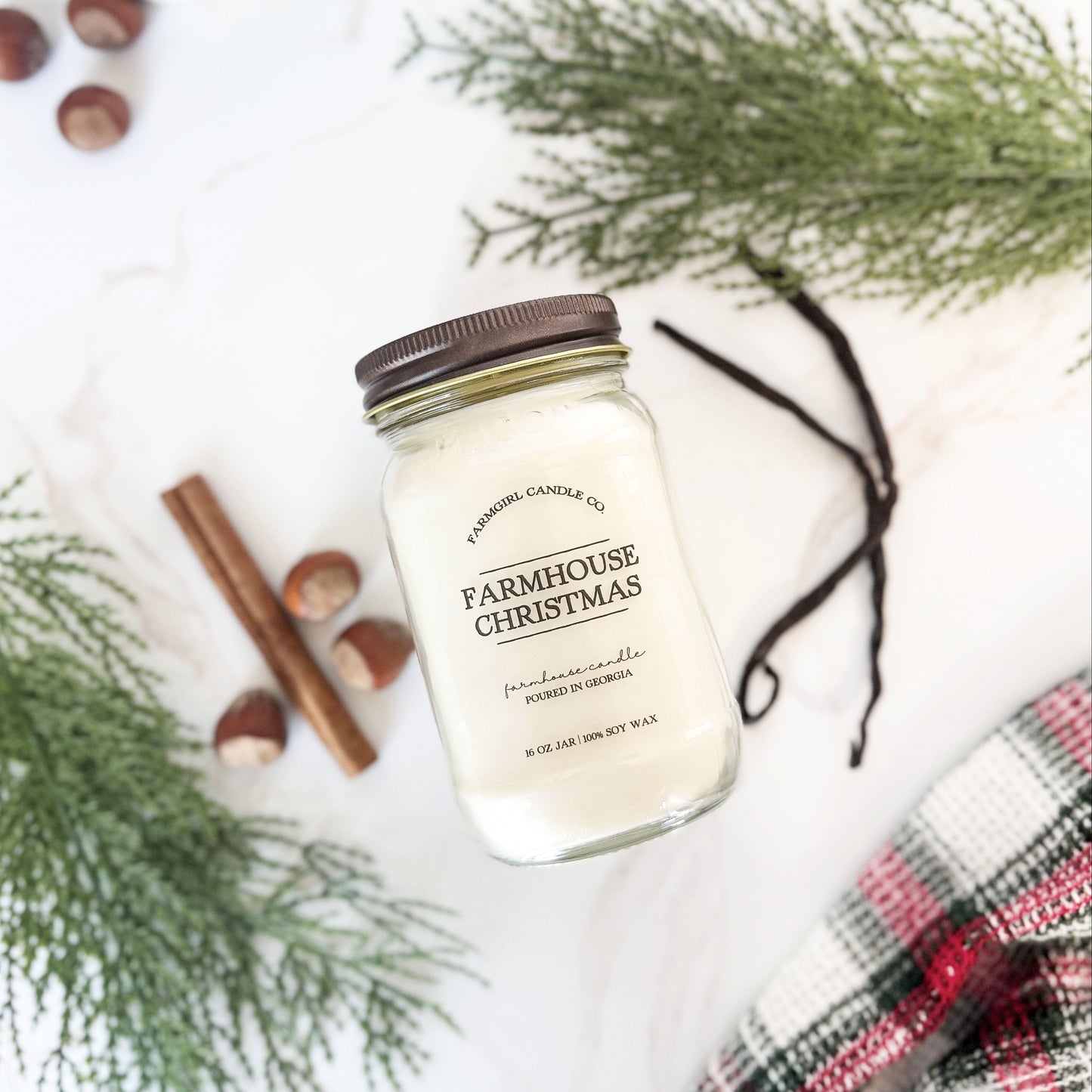 mason jar candle labeled 'Farmhouse Christmas' with pine, vanilla, spice, soy candle, farmhouse candle