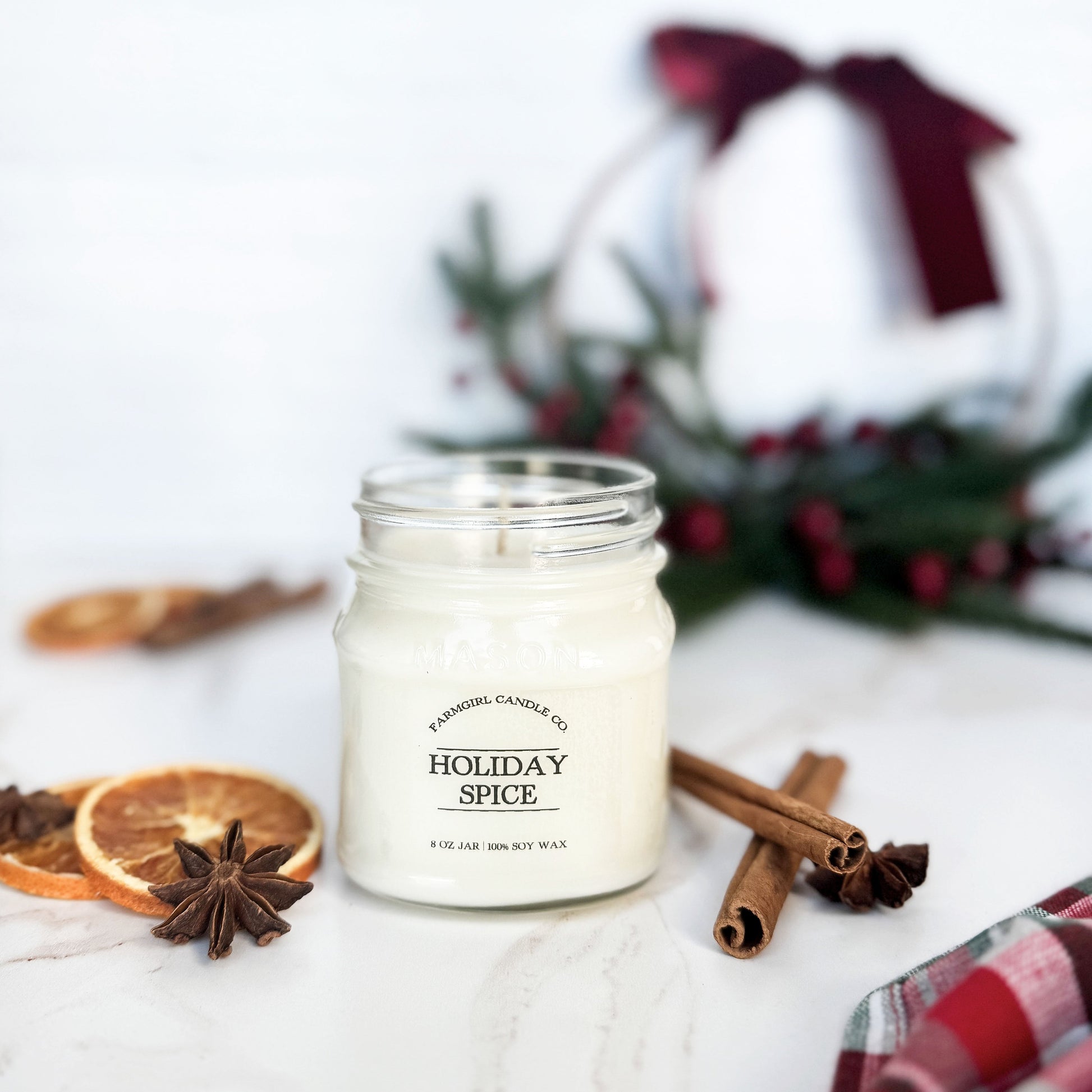 mason jar candle labeled 'Holiday Spice' with cinnamon sticks, oranges, soy candle, farmhouse candle